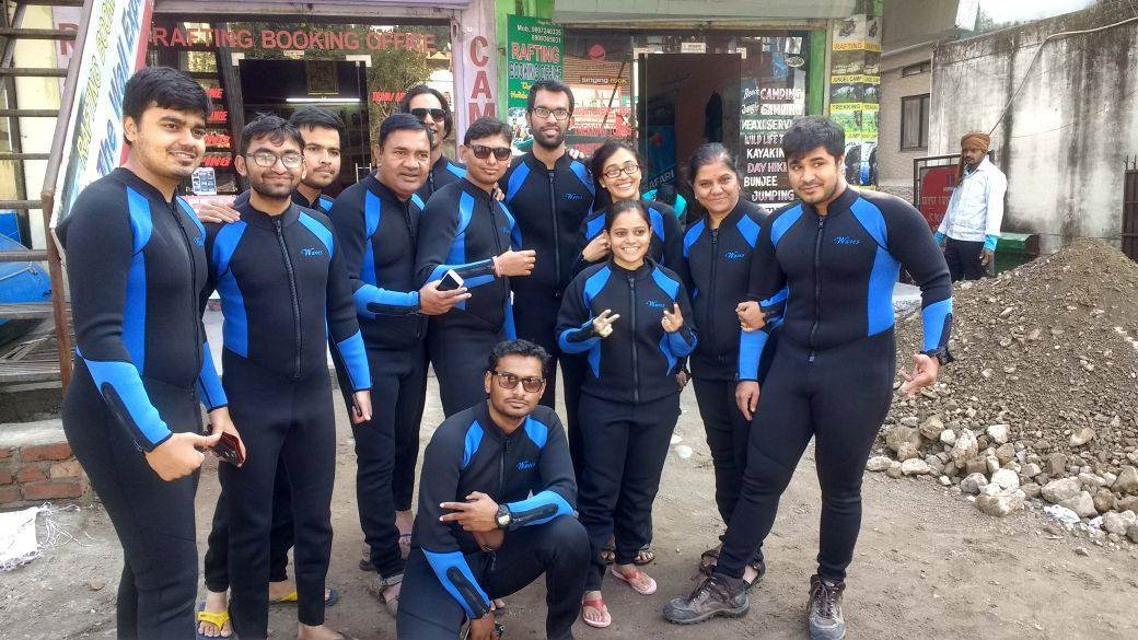 Getting ready for rafting in wet suits