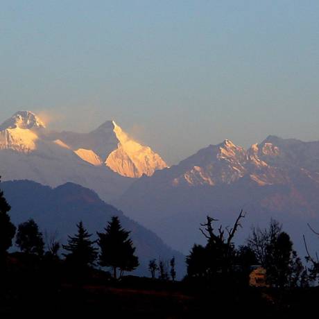 Beautiful view of snow capped mountains with golden sunshine from Chaukori.