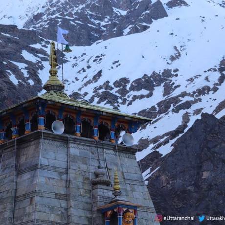Dome of  Shri kedarnath temple & snow capped mountains view in the backdrop. May 2019.