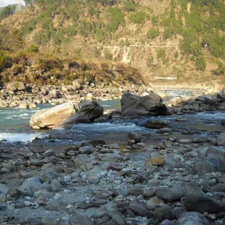 The confluence of Nandakini River (foreground) with Alaknanda River (background) in Nandprayag