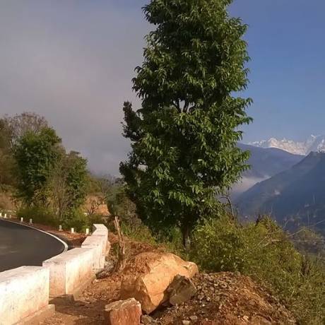 Roads in Rudraprayag and snow capped mountains in the backdrop.