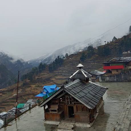 Someshwar Devta temple of Sankri after fresh snowfall in the nearby hills.